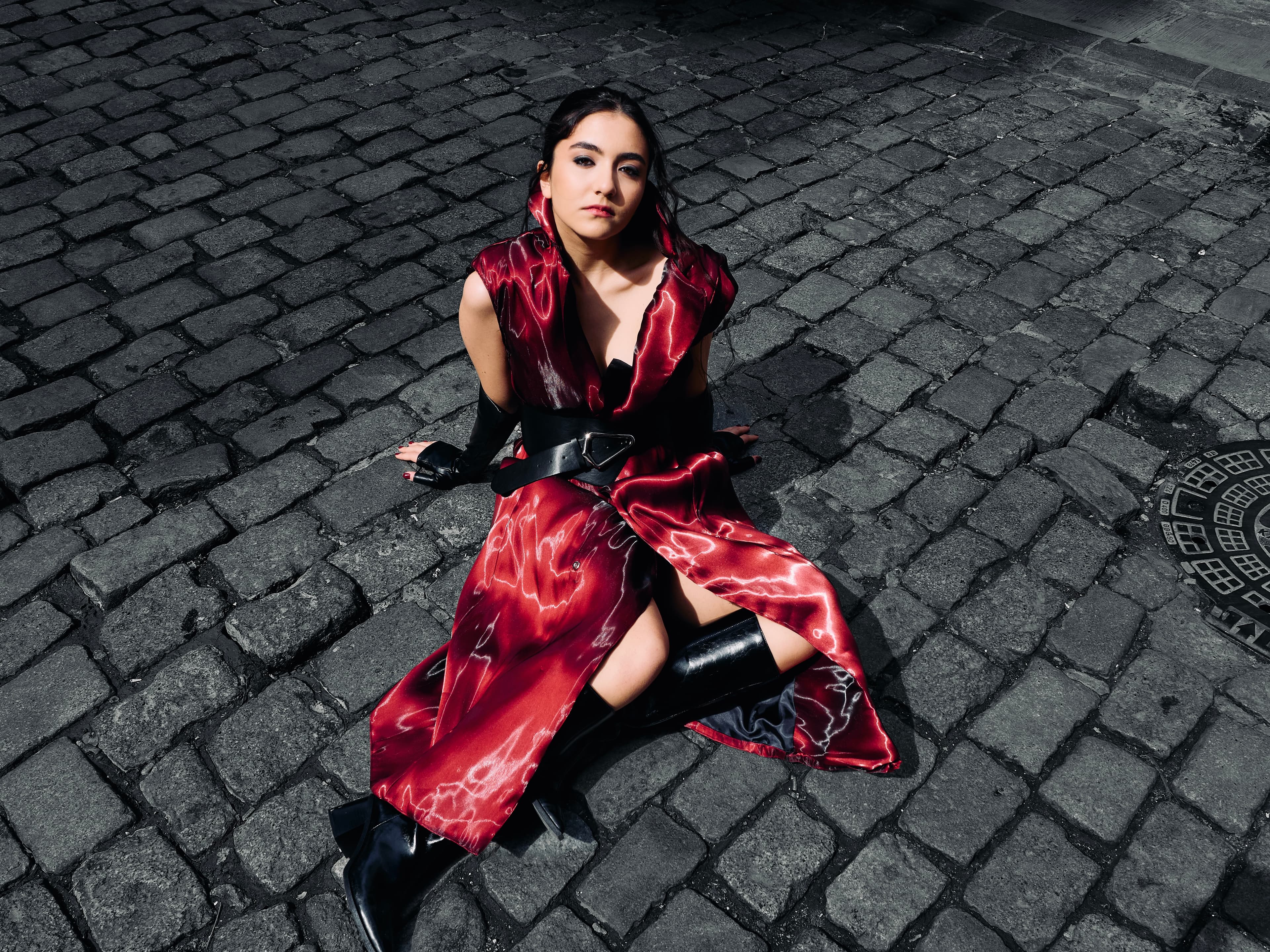 Bahar in a cinematic burgundy and black portrait